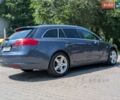Синий Опель Инсигния, объемом двигателя 1.96 л и пробегом 296 тыс. км за 5800 $, фото 1 на Automoto.ua