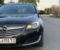 Синий Опель Инсигния, объемом двигателя 2 л и пробегом 319 тыс. км за 8500 $, фото 3 на Automoto.ua