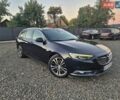 Синий Опель Инсигния, объемом двигателя 2 л и пробегом 235 тыс. км за 14600 $, фото 1 на Automoto.ua
