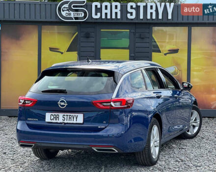 Синий Опель Инсигния, объемом двигателя 2 л и пробегом 249 тыс. км за 14999 $, фото 3 на Automoto.ua