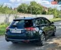 Зелений Опель Інсігнія, об'ємом двигуна 2 л та пробігом 257 тис. км за 9499 $, фото 5 на Automoto.ua