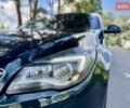 Зелений Опель Інсігнія, об'ємом двигуна 2 л та пробігом 257 тис. км за 9499 $, фото 7 на Automoto.ua