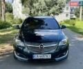 Зелений Опель Інсігнія, об'ємом двигуна 2 л та пробігом 257 тис. км за 9499 $, фото 1 на Automoto.ua
