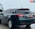Зелений Опель Інсігнія, об'ємом двигуна 2 л та пробігом 243 тис. км за 10990 $, фото 6 на Automoto.ua