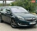 Зелений Опель Інсігнія, об'ємом двигуна 1.96 л та пробігом 257 тис. км за 10799 $, фото 1 на Automoto.ua