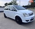 Белый Опель Мерива, объемом двигателя 1.7 л и пробегом 243 тыс. км за 3300 $, фото 1 на Automoto.ua
