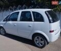 Белый Опель Мерива, объемом двигателя 1.6 л и пробегом 200 тыс. км за 4700 $, фото 1 на Automoto.ua