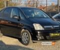 Черный Опель Мерива, объемом двигателя 1.6 л и пробегом 273 тыс. км за 5999 $, фото 1 на Automoto.ua