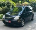 Черный Опель Мерива, объемом двигателя 1.6 л и пробегом 230 тыс. км за 3830 $, фото 1 на Automoto.ua