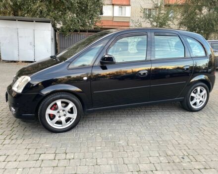 Черный Опель Мерива, объемом двигателя 1.8 л и пробегом 260 тыс. км за 5800 $, фото 1 на Automoto.ua