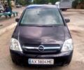 Черный Опель Мерива, объемом двигателя 1.7 л и пробегом 293 тыс. км за 4900 $, фото 2 на Automoto.ua