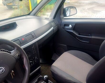 Черный Опель Мерива, объемом двигателя 1.7 л и пробегом 293 тыс. км за 4900 $, фото 7 на Automoto.ua