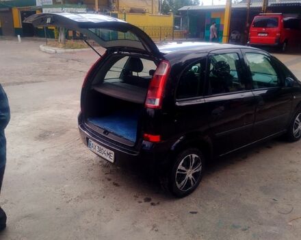 Черный Опель Мерива, объемом двигателя 1.7 л и пробегом 293 тыс. км за 4900 $, фото 4 на Automoto.ua