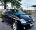 Черный Опель Мерива, объемом двигателя 1.6 л и пробегом 251 тыс. км за 3900 $, фото 1 на Automoto.ua