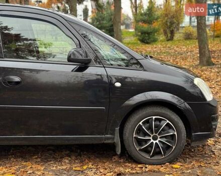 Черный Опель Мерива, объемом двигателя 1.6 л и пробегом 262 тыс. км за 4740 $, фото 5 на Automoto.ua