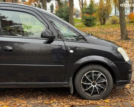 Черный Опель Мерива, объемом двигателя 1.6 л и пробегом 262 тыс. км за 4740 $, фото 5 на Automoto.ua