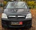 Черный Опель Мерива, объемом двигателя 1.6 л и пробегом 262 тыс. км за 4740 $, фото 2 на Automoto.ua