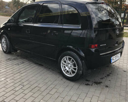 Черный Опель Мерива, объемом двигателя 1.25 л и пробегом 197 тыс. км за 3650 $, фото 7 на Automoto.ua