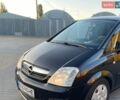 Черный Опель Мерива, объемом двигателя 1.69 л и пробегом 174 тыс. км за 3800 $, фото 1 на Automoto.ua
