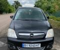 Черный Опель Мерива, объемом двигателя 1.6 л и пробегом 315 тыс. км за 3400 $, фото 1 на Automoto.ua
