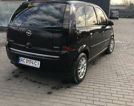 Черный Опель Мерива, объемом двигателя 1.25 л и пробегом 197 тыс. км за 3650 $, фото 4 на Automoto.ua