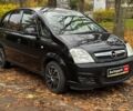 Черный Опель Мерива, объемом двигателя 1.6 л и пробегом 262 тыс. км за 4740 $, фото 4 на Automoto.ua
