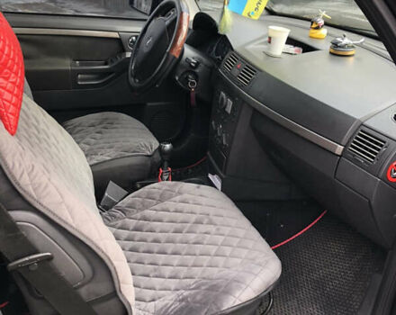 Черный Опель Мерива, объемом двигателя 1.25 л и пробегом 197 тыс. км за 3650 $, фото 6 на Automoto.ua