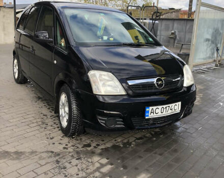 Черный Опель Мерива, объемом двигателя 1.25 л и пробегом 197 тыс. км за 3650 $, фото 1 на Automoto.ua