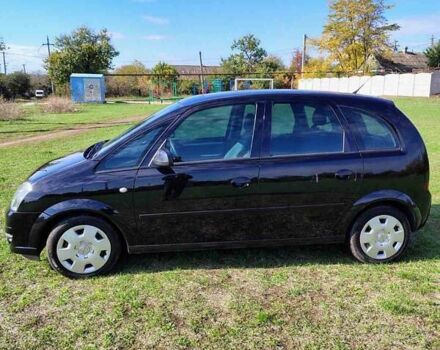 Черный Опель Мерива, объемом двигателя 1.36 л и пробегом 184 тыс. км за 5000 $, фото 1 на Automoto.ua