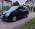 Черный Опель Мерива, объемом двигателя 1.36 л и пробегом 184 тыс. км за 5000 $, фото 2 на Automoto.ua
