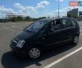 Черный Опель Мерива, объемом двигателя 1.6 л и пробегом 170 тыс. км за 5000 $, фото 1 на Automoto.ua