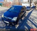 Черный Опель Мерива, объемом двигателя 1.7 л и пробегом 222 тыс. км за 4450 $, фото 1 на Automoto.ua