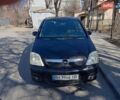 Черный Опель Мерива, объемом двигателя 1.69 л и пробегом 222 тыс. км за 4900 $, фото 1 на Automoto.ua