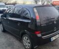 Черный Опель Мерива, объемом двигателя 1.36 л и пробегом 299 тыс. км за 4050 $, фото 1 на Automoto.ua