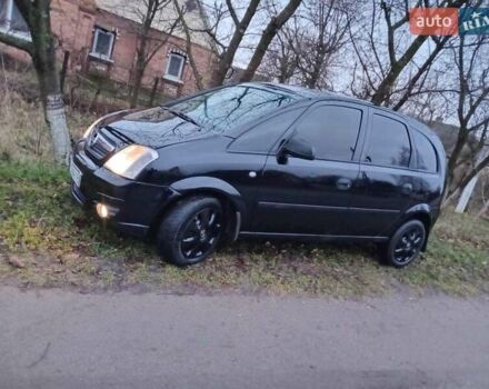 Черный Опель Мерива, объемом двигателя 1.6 л и пробегом 145 тыс. км за 3850 $, фото 2 на Automoto.ua