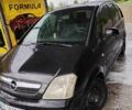 Черный Опель Мерива, объемом двигателя 1.3 л и пробегом 253 тыс. км за 3907 $, фото 1 на Automoto.ua