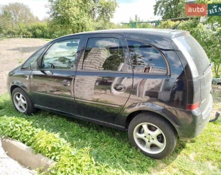 Черный Опель Мерива, объемом двигателя 1.36 л и пробегом 160 тыс. км за 3800 $, фото 1 на Automoto.ua