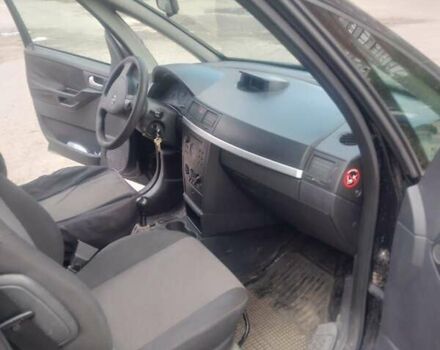 Черный Опель Мерива, объемом двигателя 1.69 л и пробегом 292 тыс. км за 4500 $, фото 1 на Automoto.ua