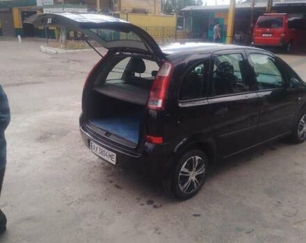 Черный Опель Мерива, объемом двигателя 1.69 л и пробегом 292 тыс. км за 4500 $, фото 11 на Automoto.ua