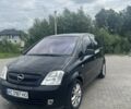 Черный Опель Мерива, объемом двигателя 1.8 л и пробегом 176 тыс. км за 4600 $, фото 1 на Automoto.ua