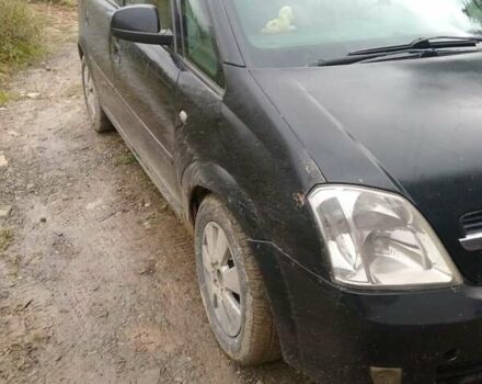 Черный Опель Мерива, объемом двигателя 1.69 л и пробегом 240 тыс. км за 2800 $, фото 4 на Automoto.ua