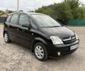 Черный Опель Мерива, объемом двигателя 1.6 л и пробегом 185 тыс. км за 3600 $, фото 1 на Automoto.ua