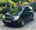Черный Опель Мерива, объемом двигателя 1.6 л и пробегом 230 тыс. км за 4090 $, фото 1 на Automoto.ua