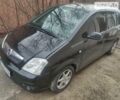 Черный Опель Мерива, объемом двигателя 1.6 л и пробегом 250 тыс. км за 3800 $, фото 1 на Automoto.ua