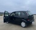 Черный Опель Мерива, объемом двигателя 1.3 л и пробегом 260 тыс. км за 4100 $, фото 4 на Automoto.ua