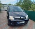 Черный Опель Мерива, объемом двигателя 1.6 л и пробегом 92 тыс. км за 4600 $, фото 1 на Automoto.ua