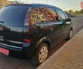 Черный Опель Мерива, объемом двигателя 1.4 л и пробегом 115 тыс. км за 4899 $, фото 4 на Automoto.ua