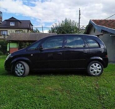 Черный Опель Мерива, объемом двигателя 1.3 л и пробегом 134 тыс. км за 4500 $, фото 1 на Automoto.ua