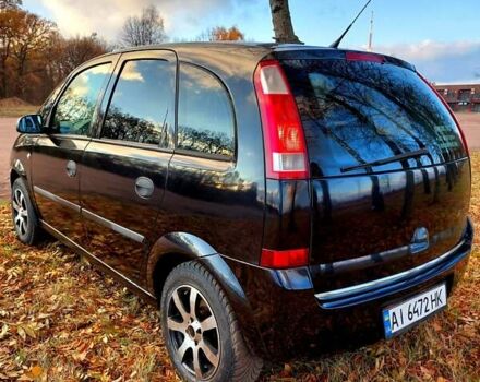 Черный Опель Мерива, объемом двигателя 1.6 л и пробегом 280 тыс. км за 4300 $, фото 1 на Automoto.ua