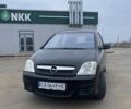 Черный Опель Мерива, объемом двигателя 1.3 л и пробегом 260 тыс. км за 4100 $, фото 1 на Automoto.ua